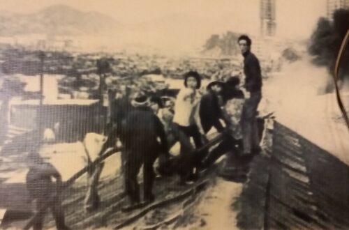 On the second day of the Lunar New Year in 1976, a No 5-alarm fire broke out in the squatter area next to Aldrich Bay. Chuen Gor (in white shirt) followed the fire brigade to fight the fire overnight. This photo is still posted on the wall of a restaurant on Main Street East.